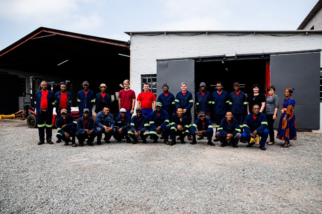 The Titan Pumps team standing together in front of their manufacturing facility in Orkney, South Africa